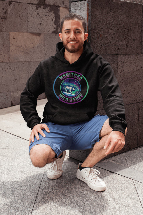 Embrace the power and beauty of the north with our Manitoba – Wild & Free hoodie, featuring a bold graphic of a polar bear beneath the awe-inspiring northern lights.